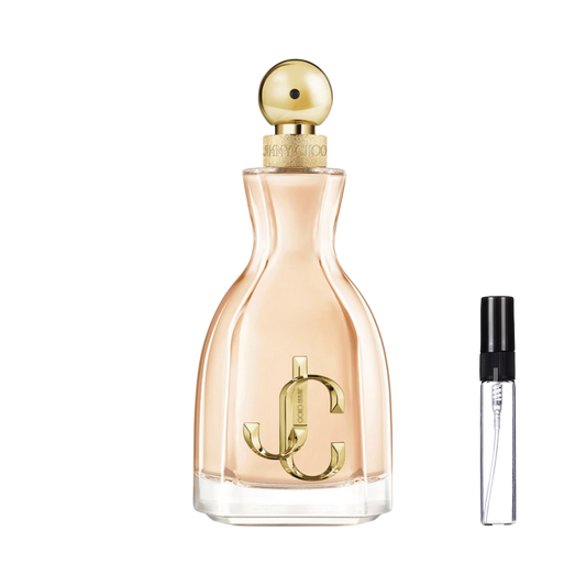 Elegancki flakon w kształcie klepsydry z brzoskwiniowym płynem, dużym złotym monogramem JC i kulistym korkiem oraz szklana fiolka odlewki na ulubiony zapach – ODVARO